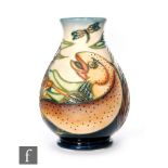 A Moorcroft Pottery vase in the Trout pattern, of footed ovoid form with everted rim, impressed