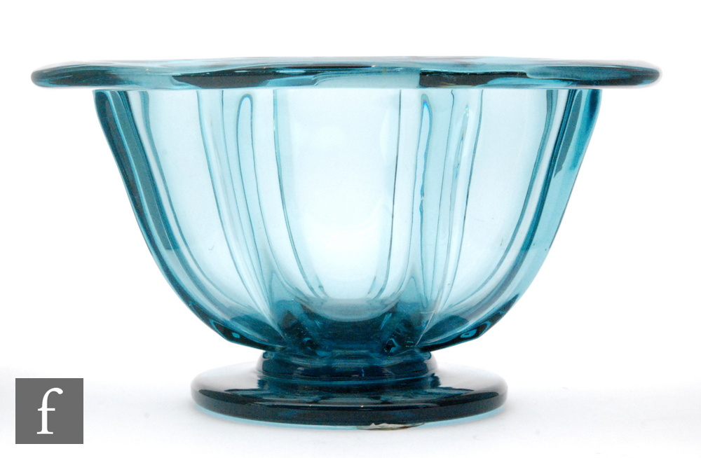 A 20th Century footed bowl designed by Ellis Berg for Kosta Boda footed form with a lobed body and