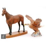 A Beswick model of Arkle, model 2065 from the Connoisseur Horses series, raised to an oval plinth,