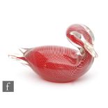 A later 20th Century Murano glass sculpture in the form of a stylised swan, ruby with white canes