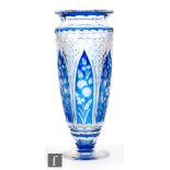 An early 20th Century Stourbridge glass vase of footed sleeve form with everted rim, cased in blue