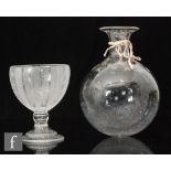 A 19th Century wine flask of spherical form with collar neck engraved with a vine collar and