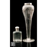 An early 20th Century John Walsh Walsh glass vase of footed slender tapering form with cut and