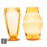 A 1940s Whitefriars footed vase designed by James Hogan, of compressed lobed form in golden amber,