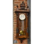 A late 19th Century walnut cased regulator wall clock with weight driven movement, the circular