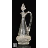 A 19th Century clear crystal claret jug of footed tapered form, cut with a strawberry diamond