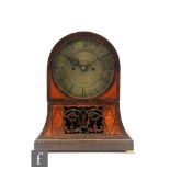 A 19th Century and later rosewood and satinwood veneered arch shaped mantel clock, raised to brass