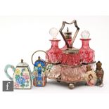 Two miniature enamelled teapots, a Victorian transfer printed scent bottle decorated with a female