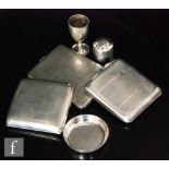 Three hallmarked silver cigarette cases each with engine turned decoration with a small dish, an egg