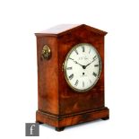 A 19th Century mahogany bracket clock of architectural form, with brass ring loop handles, an