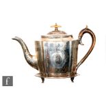A George III hallmarked silver boat shaped tea pot with part bright cut decoration and turned wooden