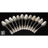 Twelve hallmarked silver George III and later fiddle pattern dessert spoons, total weight 18.5oz,