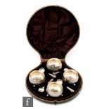 A cased set of four Victorian hallmarked silver circular open salts each with engraved fan details