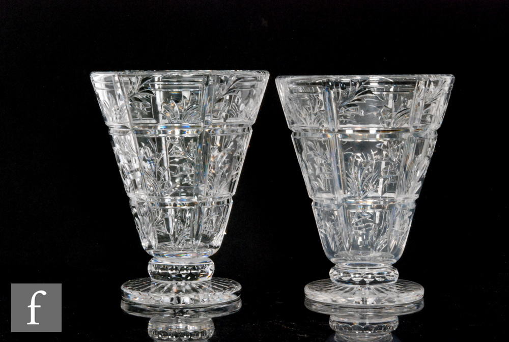 A pair of 1930s Stuart and Sons glass vases designed by Ludwig Kny, of footed conical form, cut with