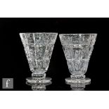 A pair of 1930s Stuart and Sons glass vases designed by Ludwig Kny, of footed conical form, cut with