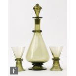 A continental decanter of footed conical form with applied ring to neck with floral prunts and