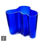 A later 20th Century Iittala glass Savoy vase by Alvar Aalto, of typical form in cobalt blue,