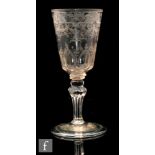 An 18th Century drinkin g glass circa 1780, round funnel bowl engraved with an exotic bird in flight