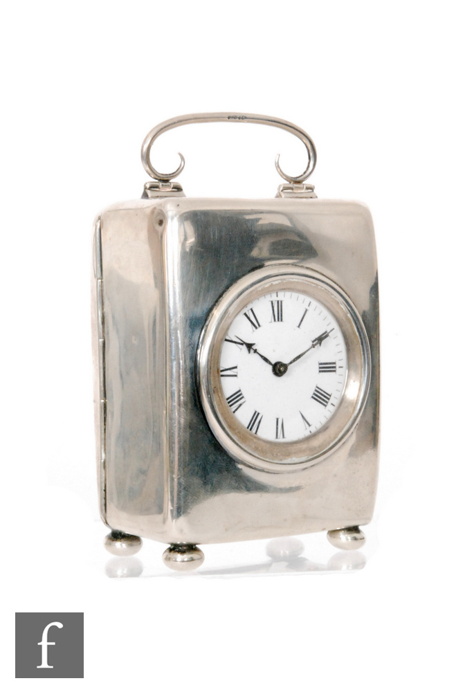 An Edwardian hallmarked silver carriage clock, Roman numerals to a white enamelled circular dial