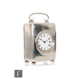 An Edwardian hallmarked silver carriage clock, Roman numerals to a white enamelled circular dial