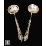 A 19th Century small ladle and matching sifting spoon each with stylised acanthus leaf detail to