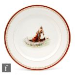 An OP Co Syracuse China plate decorated with an image of a Native American standing in a canoe,