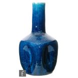 Christopher Dresser - Linthorpe Pottery - A late 19th Century vase, of bottle form with five concave