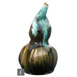 Christopher Dresser - Linthorpe Pottery - a late 19th Century double 'Gourd' vase, with compressed