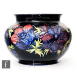 Moorcroft Pottery - A jardiniere of squat form decorated in the Anemone pattern, with tubelined