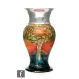 William Moorcroft - A vase of inverted baluster form decorated in the Eventide pattern with a band