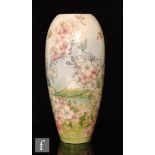 Moorcroft Pottery - A large vase decorated in the Apple Blossom pattern designed by Sally Tuffin,