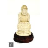 A late 19th Century Japanese ivory carving of Shakyamuni Buddha, the figure seated in dhysana,