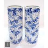 A pair of early to mid 20th Century Japanese porcelain vases, each modelled as a bamboo section, the
