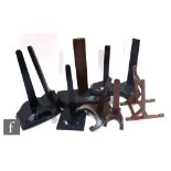 A collection of various assorted ebonised wood plate stands. (qty)