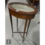 A small Edwardian inlaid mahogany bijouterie table on slender legs united by a cross stretcher,