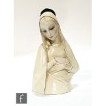 A 1930s Lenci porcelain figure of Madonna, wearing white veil and head turned and eyes downcast,