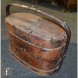 A Chinese marriage box, the hardwood three-tier box applied with brass mounts and upright rounded