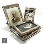 Eight assorted early 20th Century hallmarked silver easel photograph frames of plain form, height of