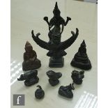 A collection of 19th to 20th Century Chinese and Indian votive figures and scroll weights, to