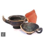 An Attic Greek kylix, circa 4th to 5th century BC, another, damaged, and a samian ware shard circa