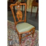 A Victorian marquetry inlaid mahogany drawing room chair, the pierced base splat decorated with a