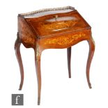 A late 19th Century French marquetry inlaid bureau, the fitted interior above a slide enclosed by