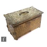 A 20th Century Eastern style brass casket decorated with raised boss design inset with coral and