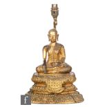 A 19th Century Sino-Tibetan gilt bronze/copper alloy figure of shakyamuni buddha, seated of a tiered