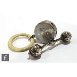 A hallmarked silver baby's rattle modelled as a dumbell, length 10cm, Birmingham 1920 Chrisford &