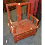 A Chinese provincial red lacquered low chair, the naively constructed chair with low single drawer