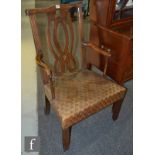 A 19th Century oak carver armchair, with a lattice panel back over a later tooled leather seat.