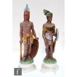 A pair of early 20th Century continental bisque figures, each modelled as native American figures,