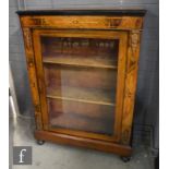 A 19th Century inlaid walnut pier cabinet enclosed by a glazed door , inlaid side pilasters and gilt