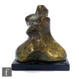 A 20th Century hollow cast bronze desk weight of organic form on black wooden base, unsigned, height